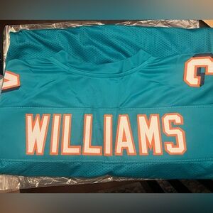 Signed Miami Dolphins Ricky Willliams Jersey.